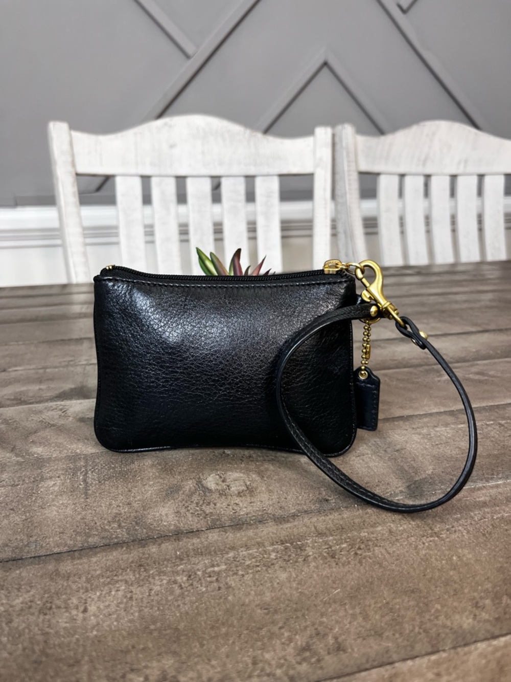 Madison black pebbled leather wristlet featuring gold-tone hardware - Picture 4 of 5